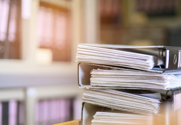 Stacked black documents at the office